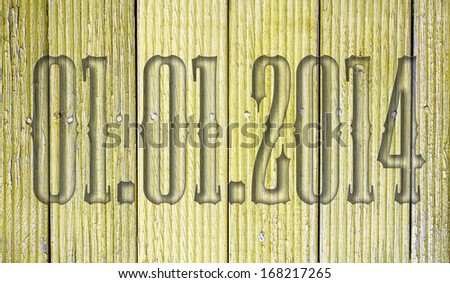 transparent embossed on wooden background 01.01.2014