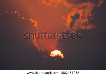 Close up blurred sun and clouds dark black background