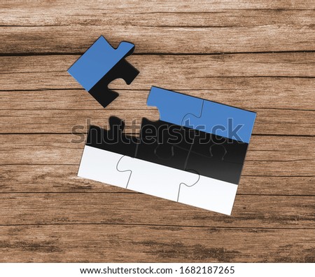 Estonia national flag on jigsaw puzzle. One piece is missing. Danger concept.