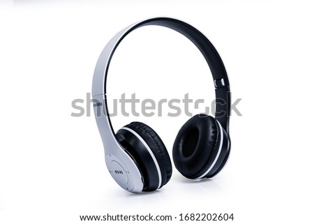 white headphone isolated on white background Royalty-Free Stock Photo #1682202604