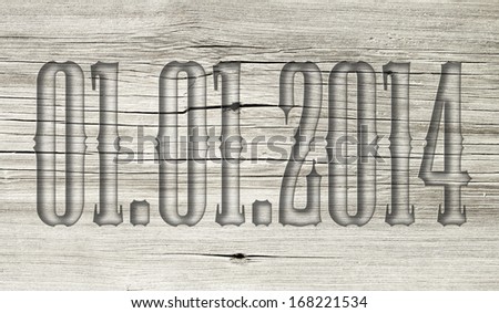 01.01.2014 transparent embossed on wooden background