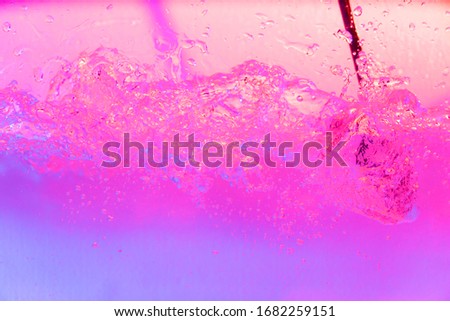 pink, purple, violet, blue colorful gradient water splash over black background. Graphic wallpaper template