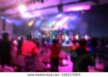 Picture blur effect./Worship God on Sunday with joy./Concert in low light and lens flare.