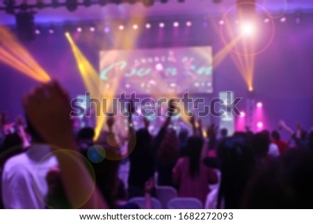 Picture blur effect./Worship God on Sunday with joy./Concert in low light and lens flare. Royalty-Free Stock Photo #1682272093