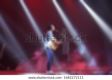 Picture blur effect./Worship God on Sunday with joy./Concert in low light and lens flare.