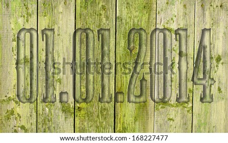 01.01.2014 transparent embossed on wooden background