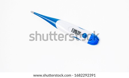 Digital clinical thermometer on white background.