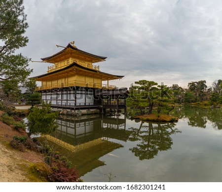 A panorama picture of the Kinkaku-ji Temple and its nearby pond.