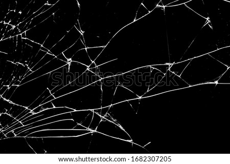 broken glass. cracks isolated on black background Royalty-Free Stock Photo #1682307205