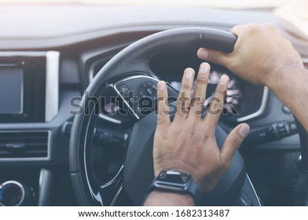 The man honk the horn in the car Royalty-Free Stock Photo #1682313487