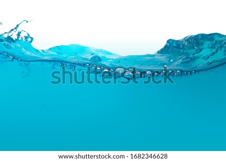 Water and bubbles surface isolated on white.blue water with splash, waves and air bubbles.Deep blue sea background