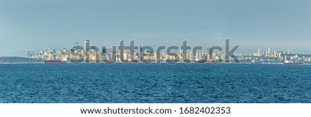 Panoramic cityscape of Vancouver, skyline view from the ocean British Columbia, Canada