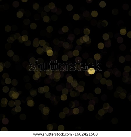Yellow bokeh on black background for art pattern