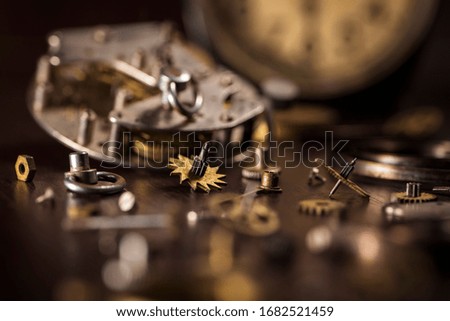 details of old watches. retro style. spare parts for watches on a wooden surface. repair, sales or maintenance concepts. watch, details mechanisms, count time. macro photo, background, place for text