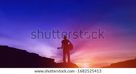 Silhouette of guitarist playing guitar and successful guitarist Silhouette concept