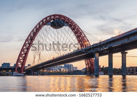 Sunset view of Picturesque bridge with big red arch over the Moscow river, Moscow, Russian Federation. Royalty-Free Stock Photo #1682527753