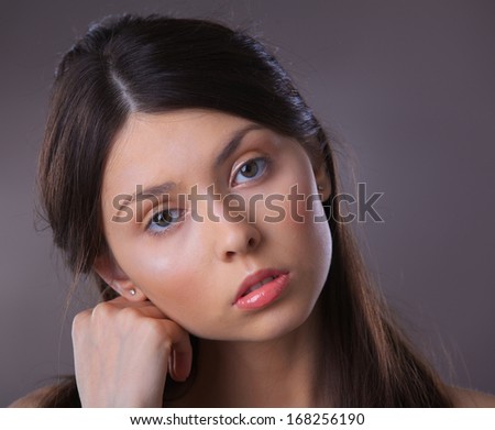 Close-up glamour portrait of beautiful woman model with fresh daily makeup and romantic hairstyle.