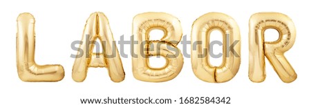 Labor word made of golden inflatable balloons isolated on white background