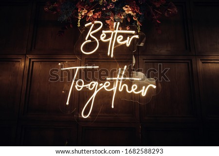 Neon sign at a wedding ceremony at a restaurant. Wedding decor