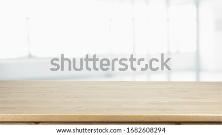 Empty Wood table on blur kitchen window background for panoramic banner