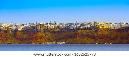 Santorini island, Greece panorama banner of Oia and Fira village on volcanic rocks with colorful houses and blue sky