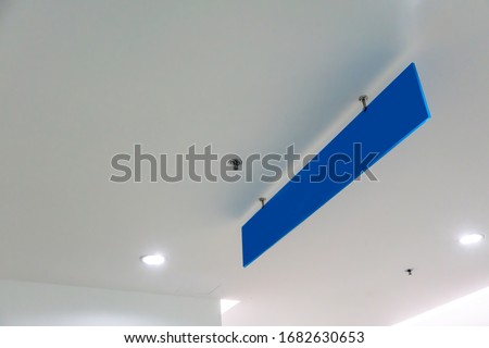 Blank blue advertising ceiling Promotional Advertising dangler for design presentation. Directional sign.