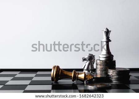 A chess king last stand as a true winner.Money game concept. Copy space. Royalty-Free Stock Photo #1682642323