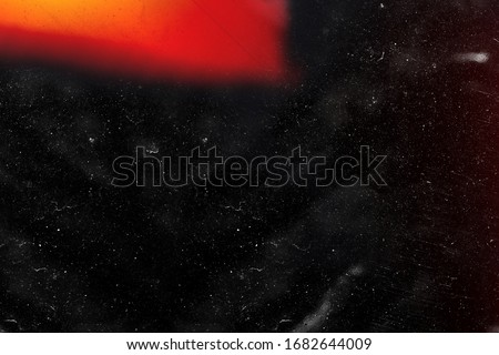 Designed film texture background with heavy grain, dust and a light leak Real Lens Flare Shot in Studio over Black Background. Easy to add as Overlay or Screen Filter over Photos overlay Royalty-Free Stock Photo #1682644009