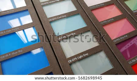trasparent colored glass material samples in catalog book (selected focus at center of picture)
