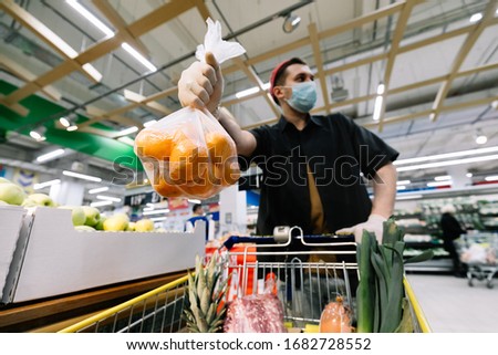 man b buys food in a hypermarket. Coronavirus, virus, infection, epidemic, pandemic. RUSSIA, RUSSIA-MARCH 19, 2020. OBNINSK