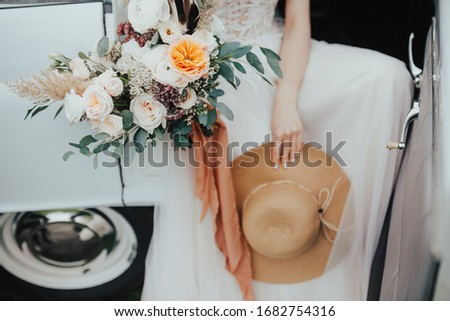 wedding bouquet with dress and hat