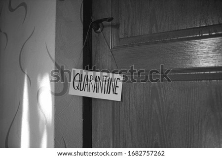 Quarantine plate. The inscription quarantine. Quarantine. Insulation. Self isolation. Black and white photo.