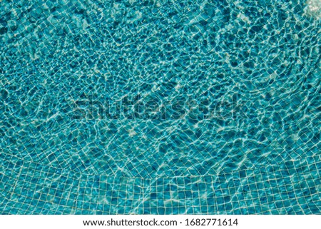 Water reflection in the pool - abstract blue background