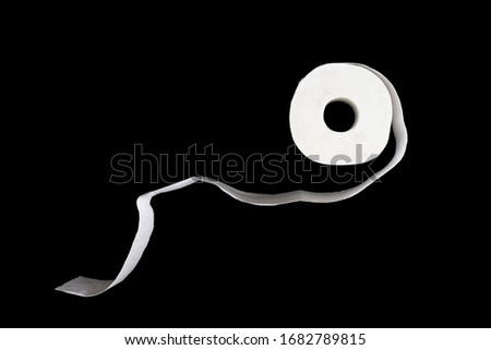 Unwound roll of toilet papaer isolated on black background. Top view. Royalty-Free Stock Photo #1682789815
