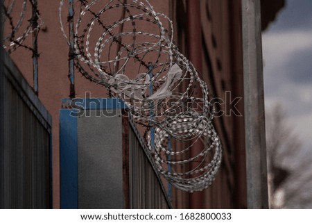 photo of barbed wire and fence