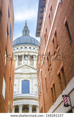 St Paul's Cathedral between brick buildings, London, England - Stock Image
