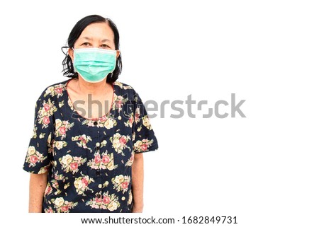 She is Asian elderly woman Asia ethnic wearing health mask to prevent virus or flu or covid19 or coronavirus isolated on white background with copy space and clipping path in picture.