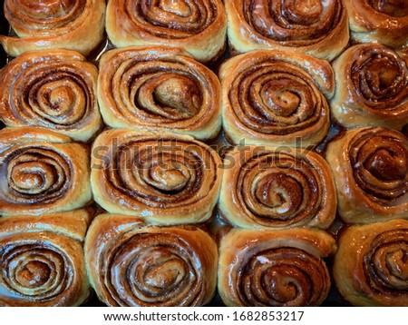 Beautiful cinnamon rolls with icing.