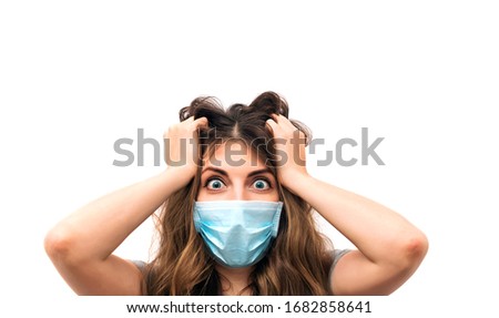Scared young woman in medical mask isolated on white background