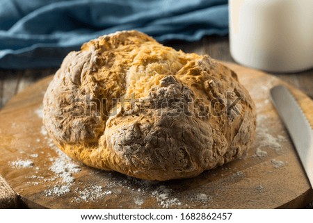 Homemade Simple Irish Soda Bread Ready to Slice Royalty-Free Stock Photo #1682862457