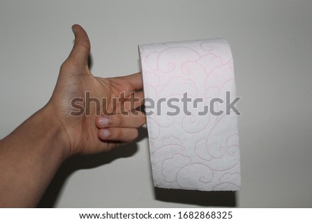 Toilet paper, hand and white background