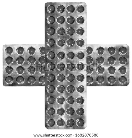 black-and-white photo of several unused foil packages of round tablets lying in the form of a cross