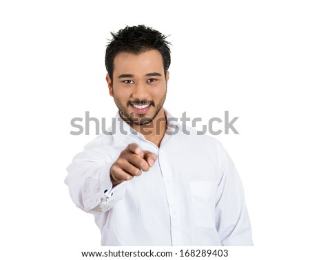 Closeup portrait of laughing , handsome, excited, happy man pointing at you camera gesture with finger, isolated on white background. Positive human emotion facial expression feeling signs symbols