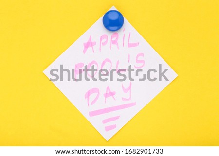 Text April Fool's Day on yellow background