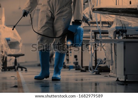Coronavirus Quarantine. Disinfection and decontamination on a public place and factory as a prevention against Coronavirus disease 2019, COVID-19. State of emergency over pandemia with coronavirus. Royalty-Free Stock Photo #1682979589