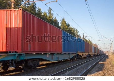 Cargo containers transportation on freight train by railway. Coronavirus Wreaks Havoc On Global Industry. Global economy is heading into a recession thanks to the widening fallout from the COVID-19 Royalty-Free Stock Photo #1682988025