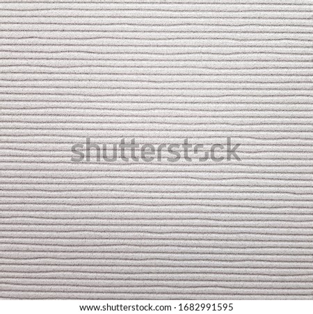 Gray ceramic tile  with striped pattern for wall and floor decoration. Concrete stone surface background. Texture with horizontal lines ornament for interior design. 