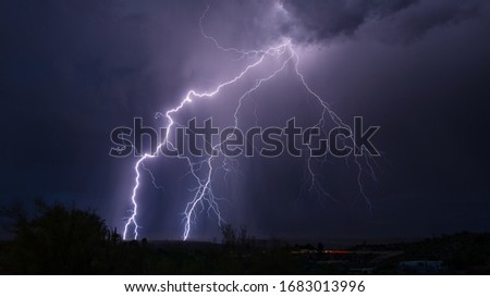Lightning bolt strike and storm clouds from a thunderstorm