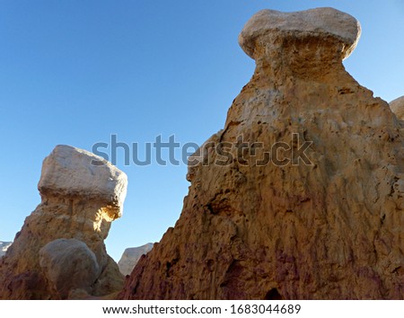 Hoodoo sandstone formations stand in the summer sunrise at Paint Mines Interpretive Park near Colorado Springs, Colorado.