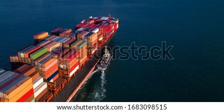 Container cargo ship business commercial trade import export logistic transportation container box oversea worldwide by container vessel boat freight shipping maritime with tugboat. Royalty-Free Stock Photo #1683098515